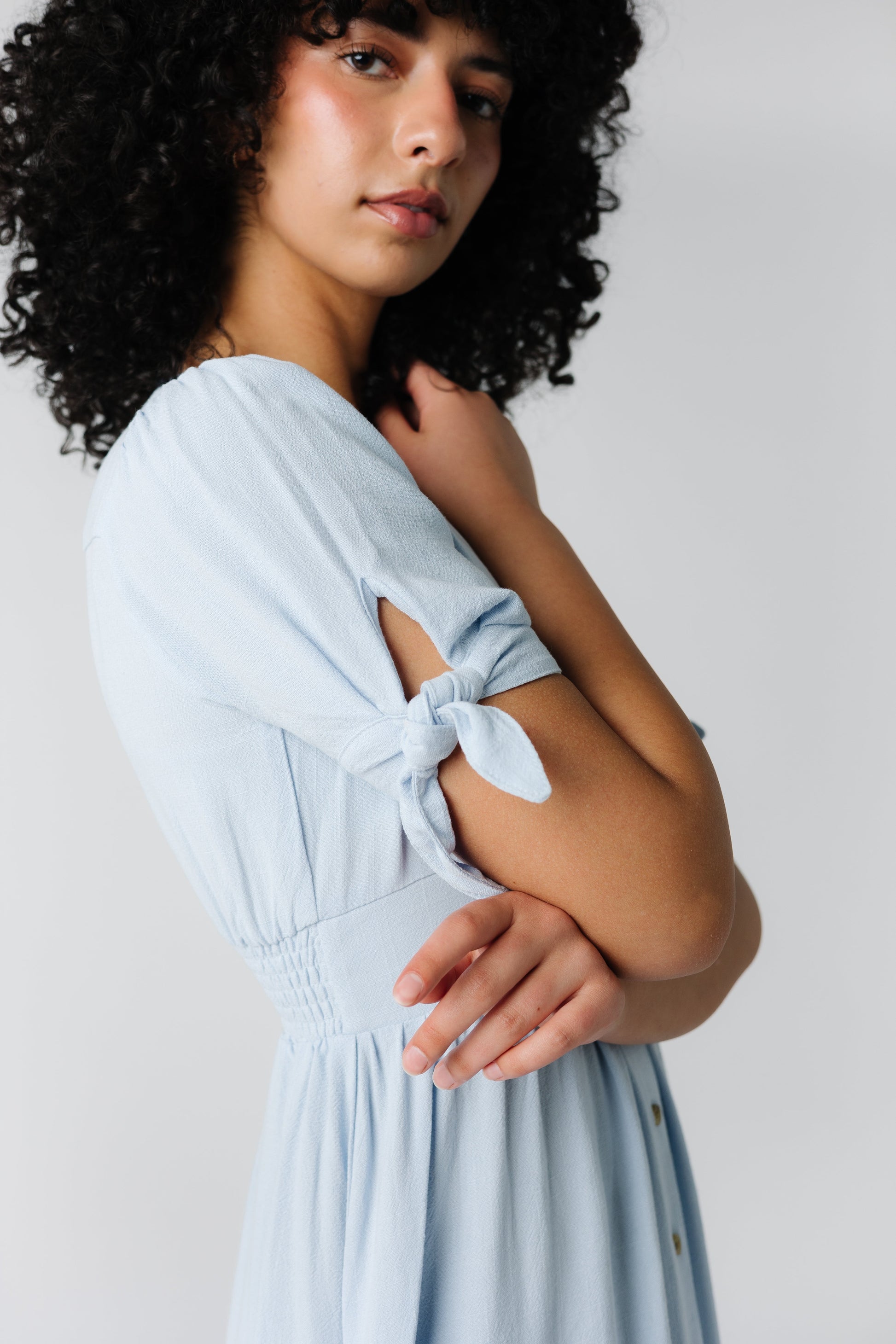 Light blue dress with short sleeves with ties