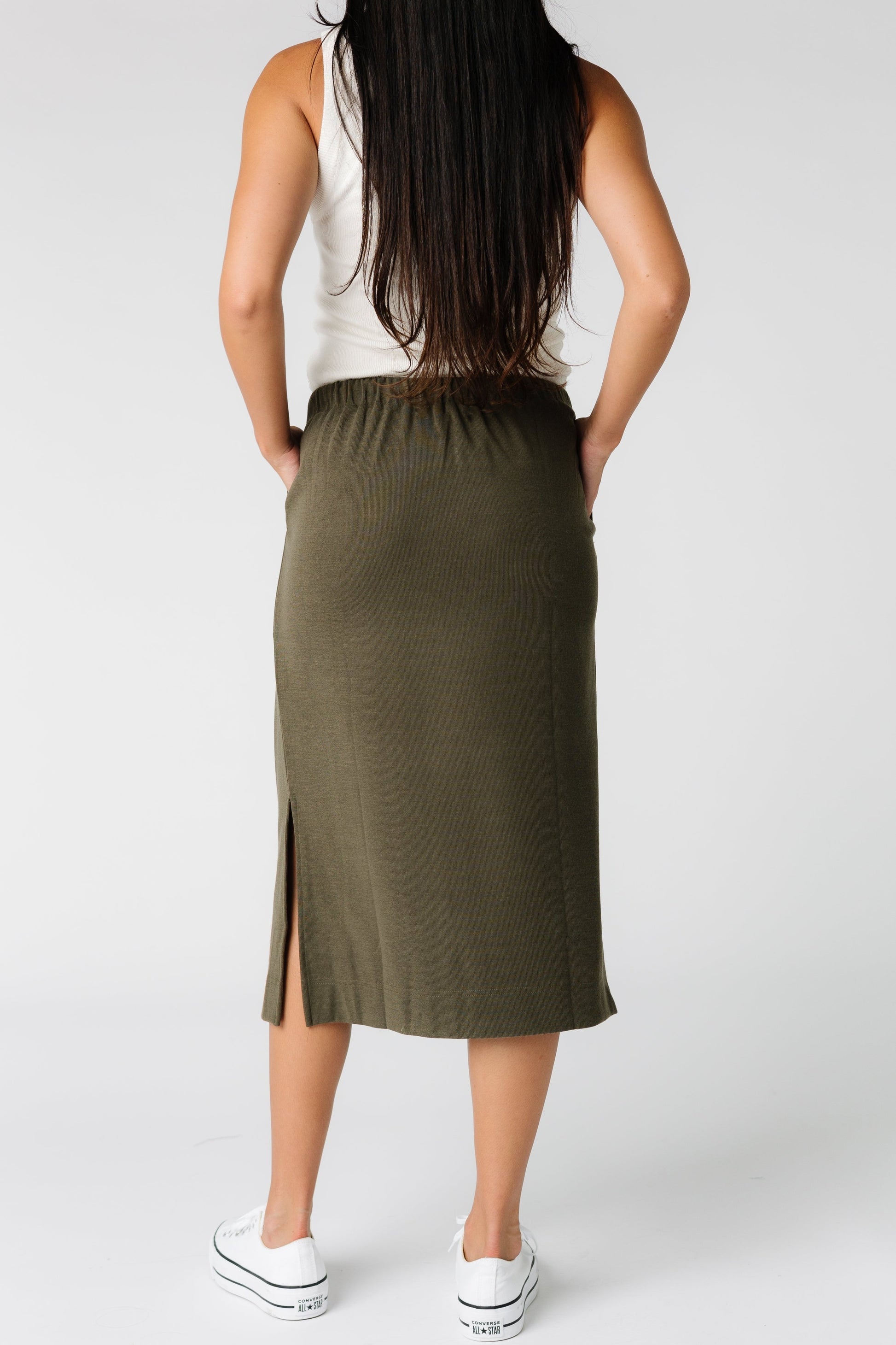 Brass & Roe back view  of olive knit skirt