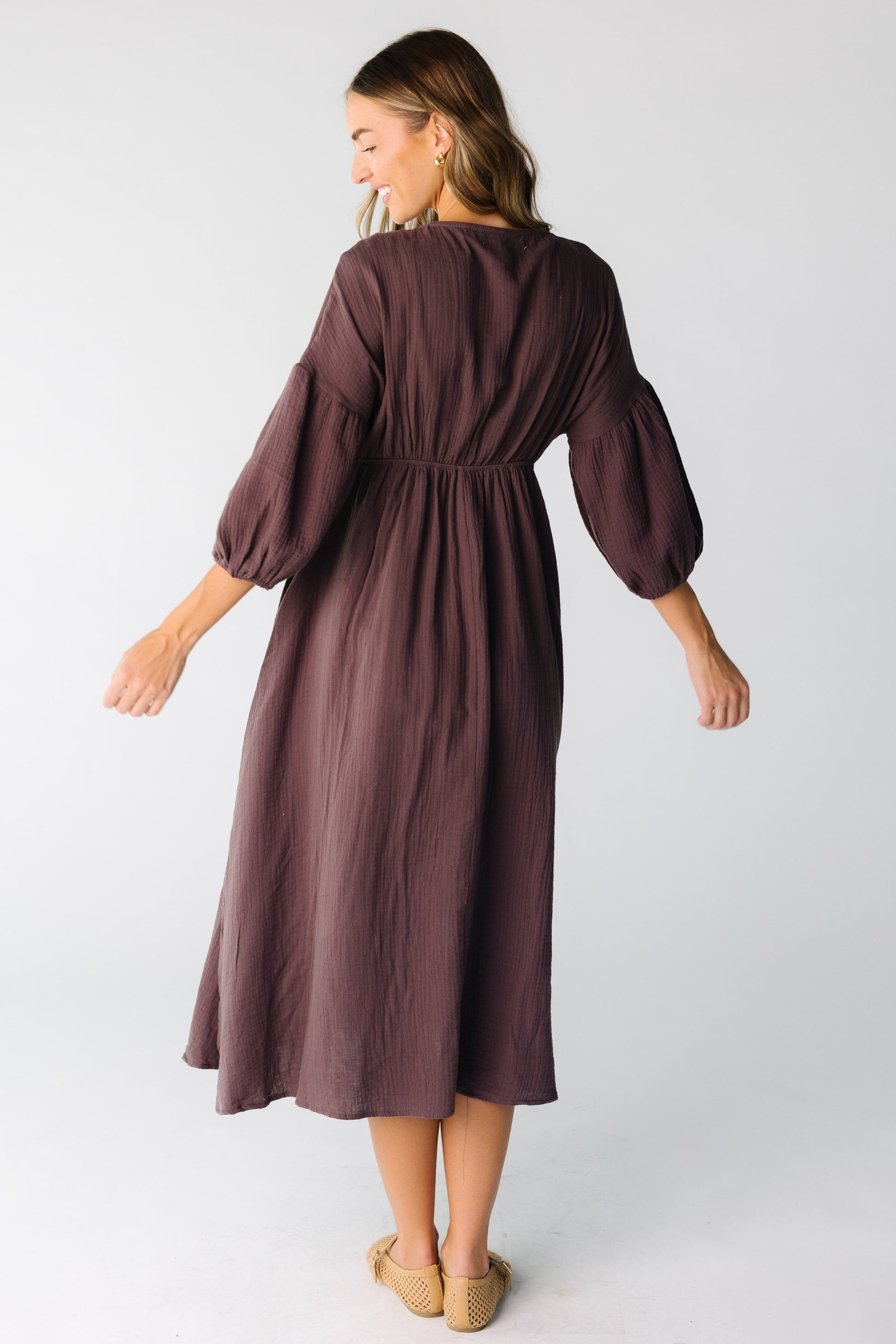 Back view of brown crepe midi with longer  sleeves