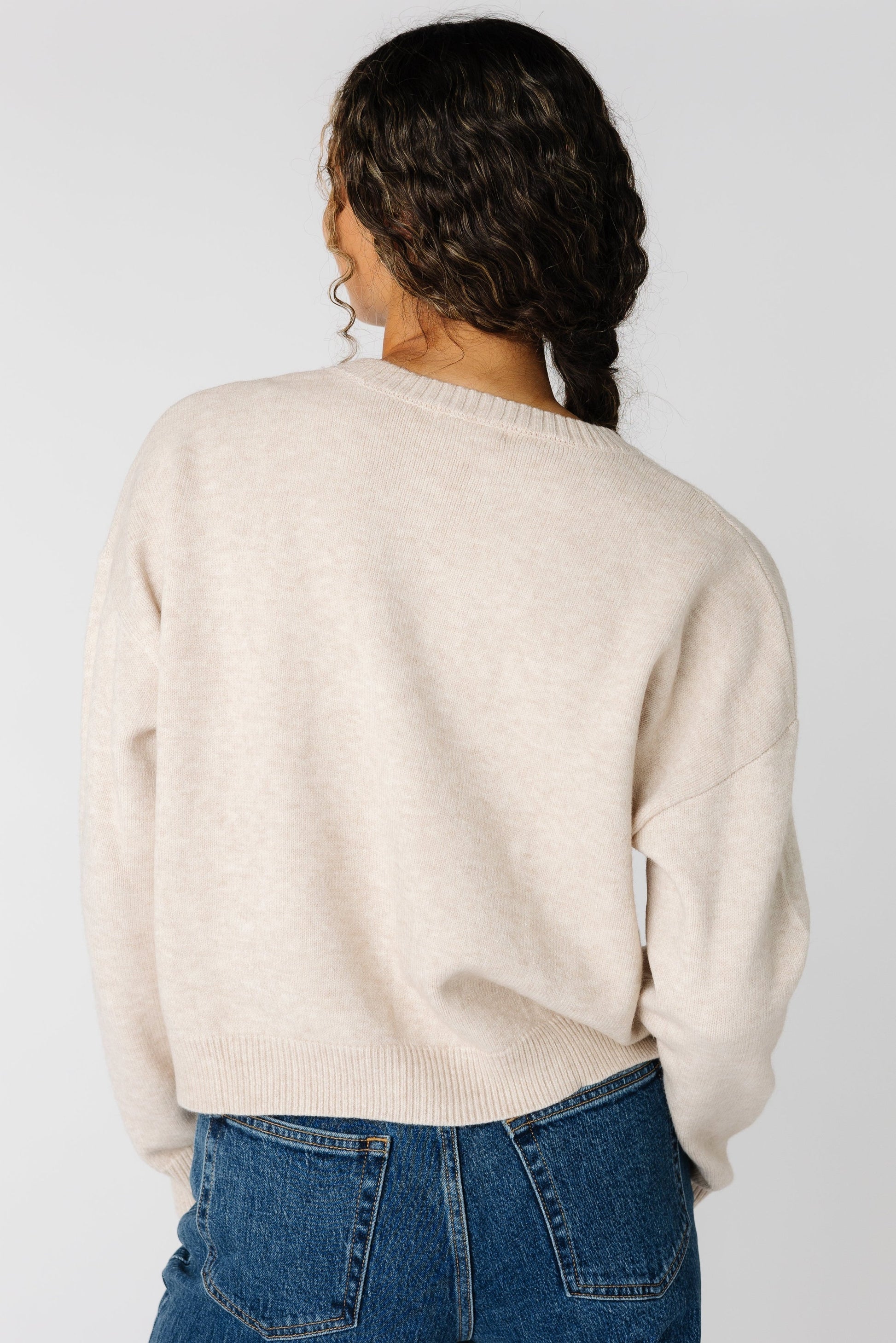 Back view of oatmeal sweater