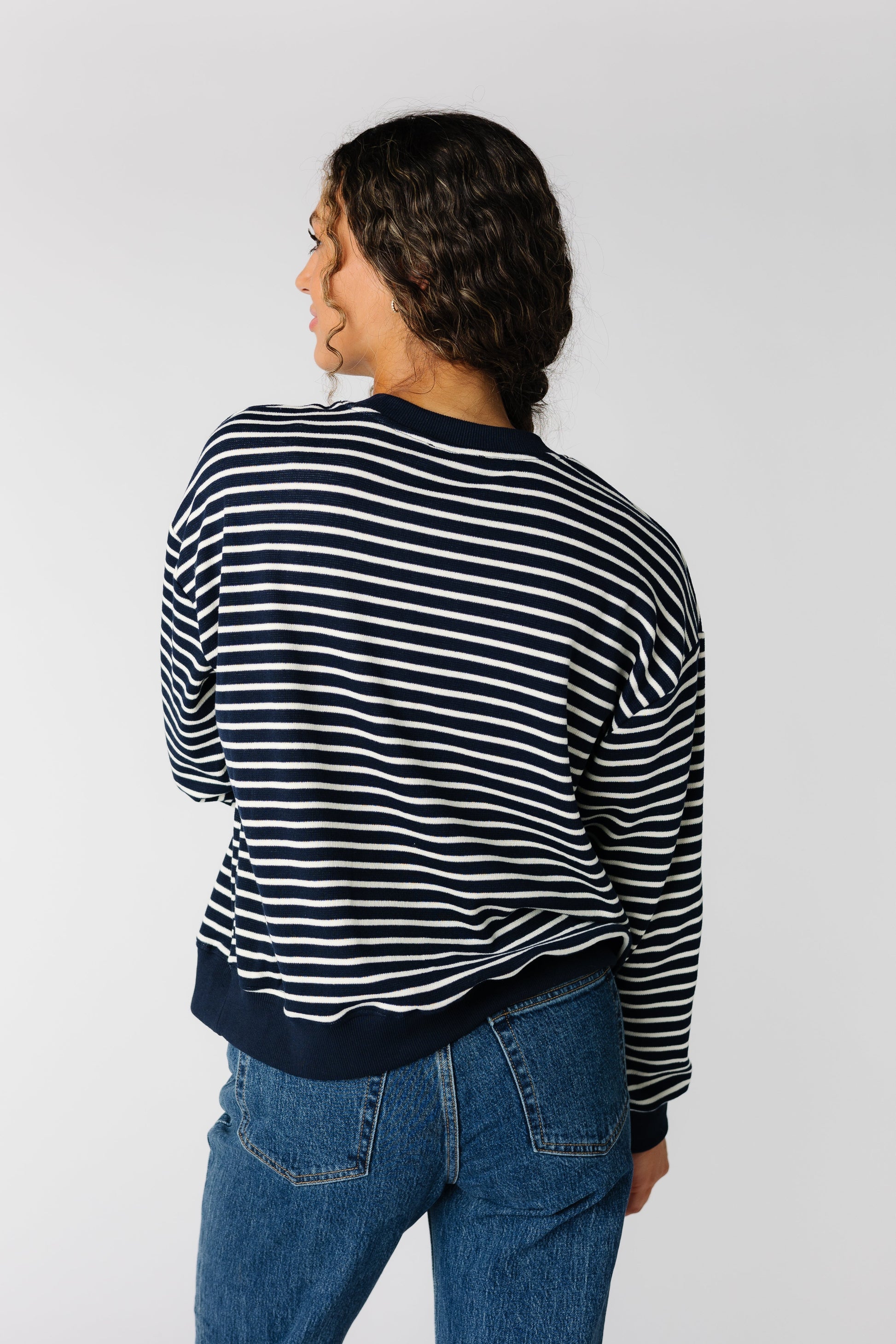 Back view of Emery modest stripe sweater