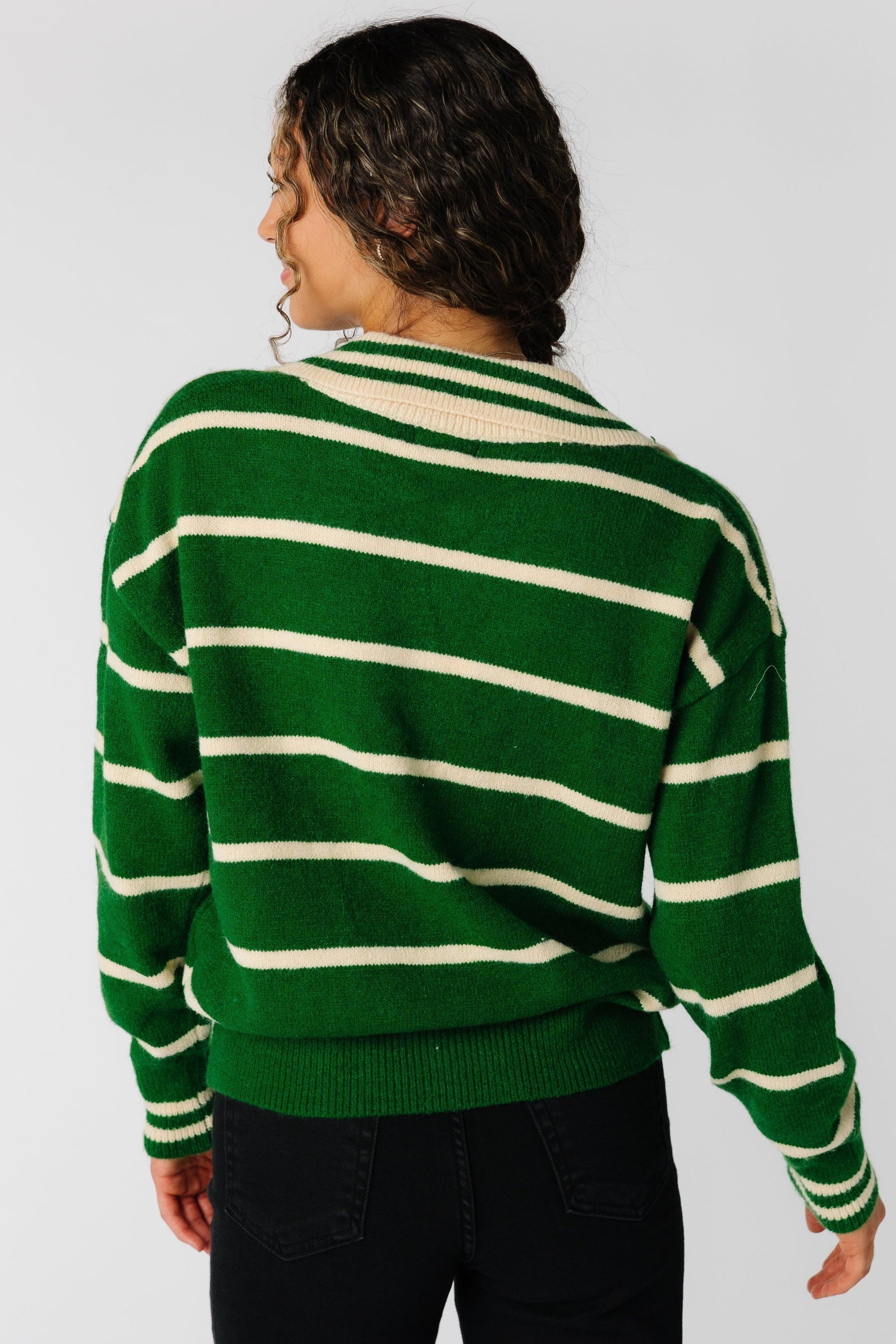 Back view of green stripe sweater