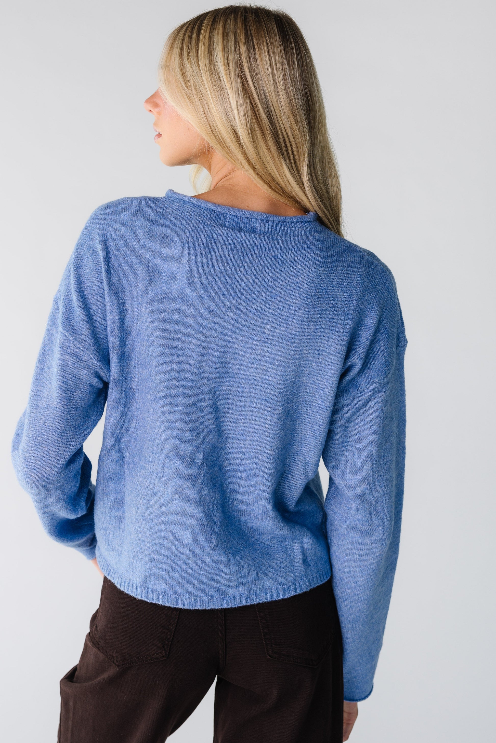 Back view of blue cardigan  and long sleeves