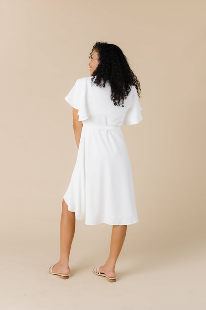 Back view of white dress with flutter sleeves