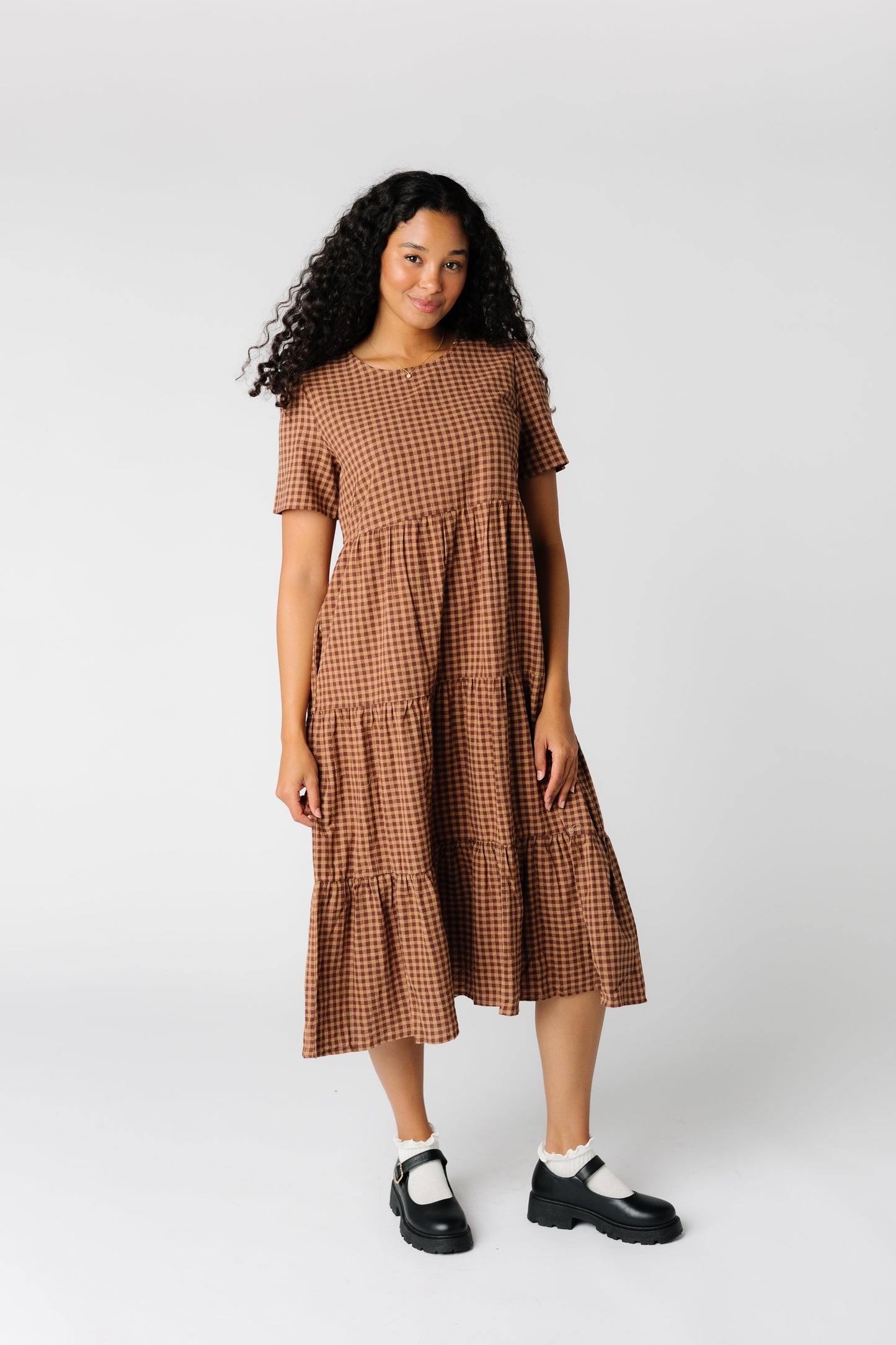 Brown gingham midi dress with multiple gathered tiers  