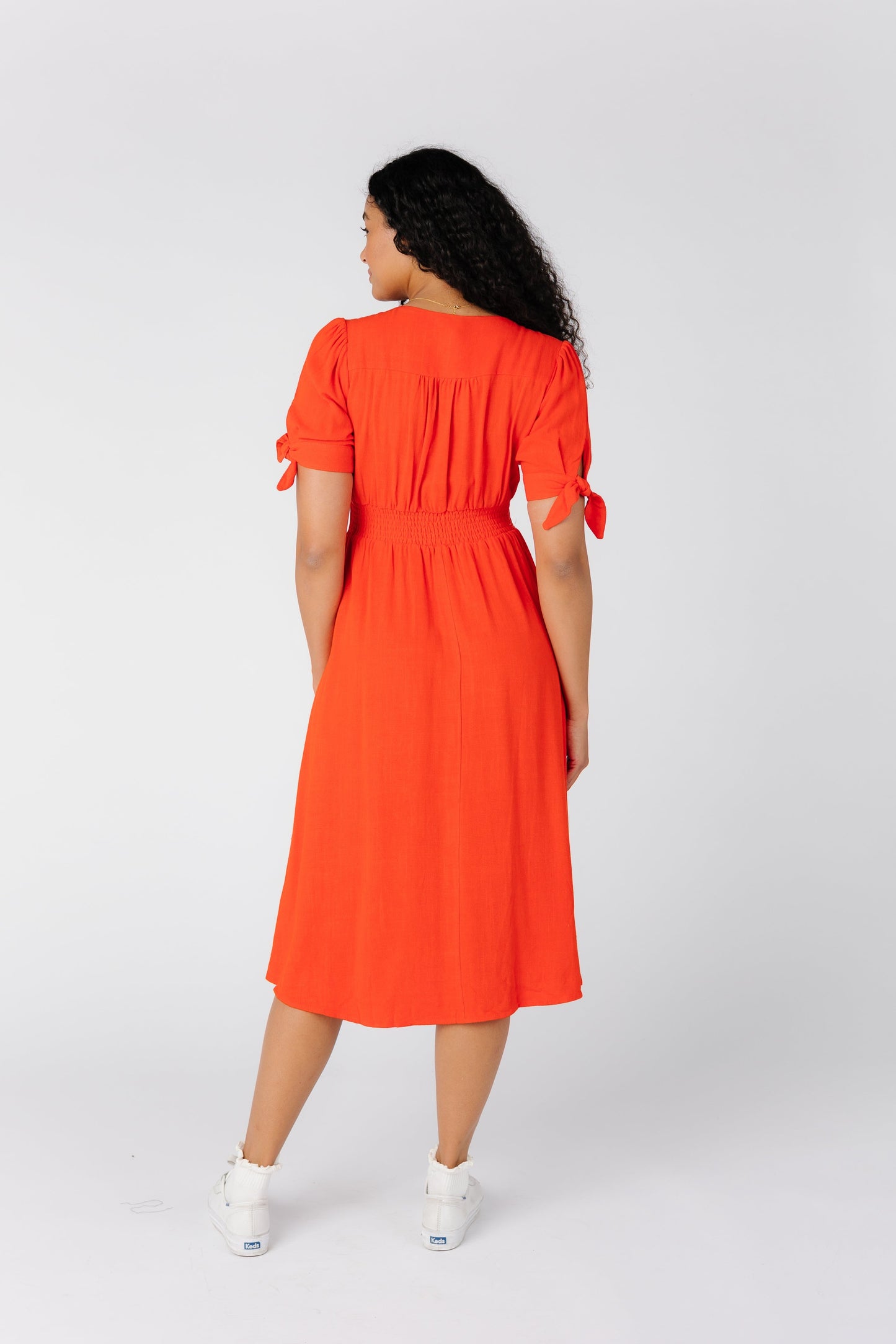 Back view of red midi dress by Brass and Roe