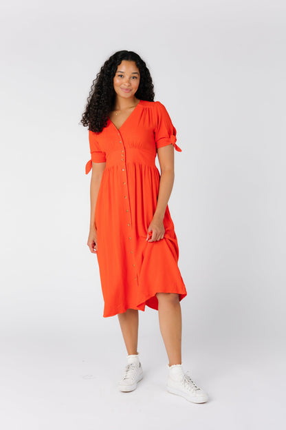 Modest red dress with short sleeves and wide waistband