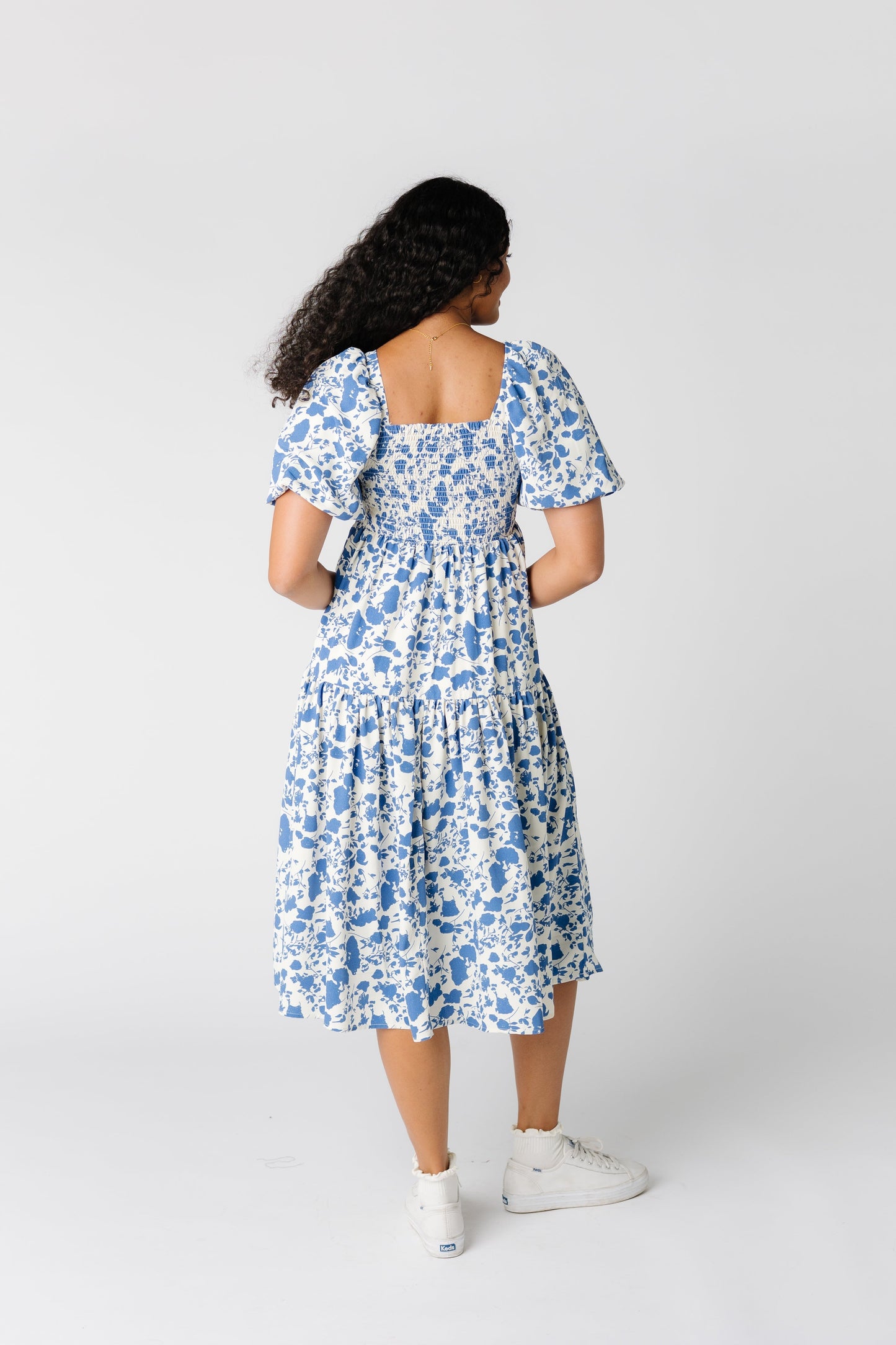 Back view of white floral print dress with square neckline