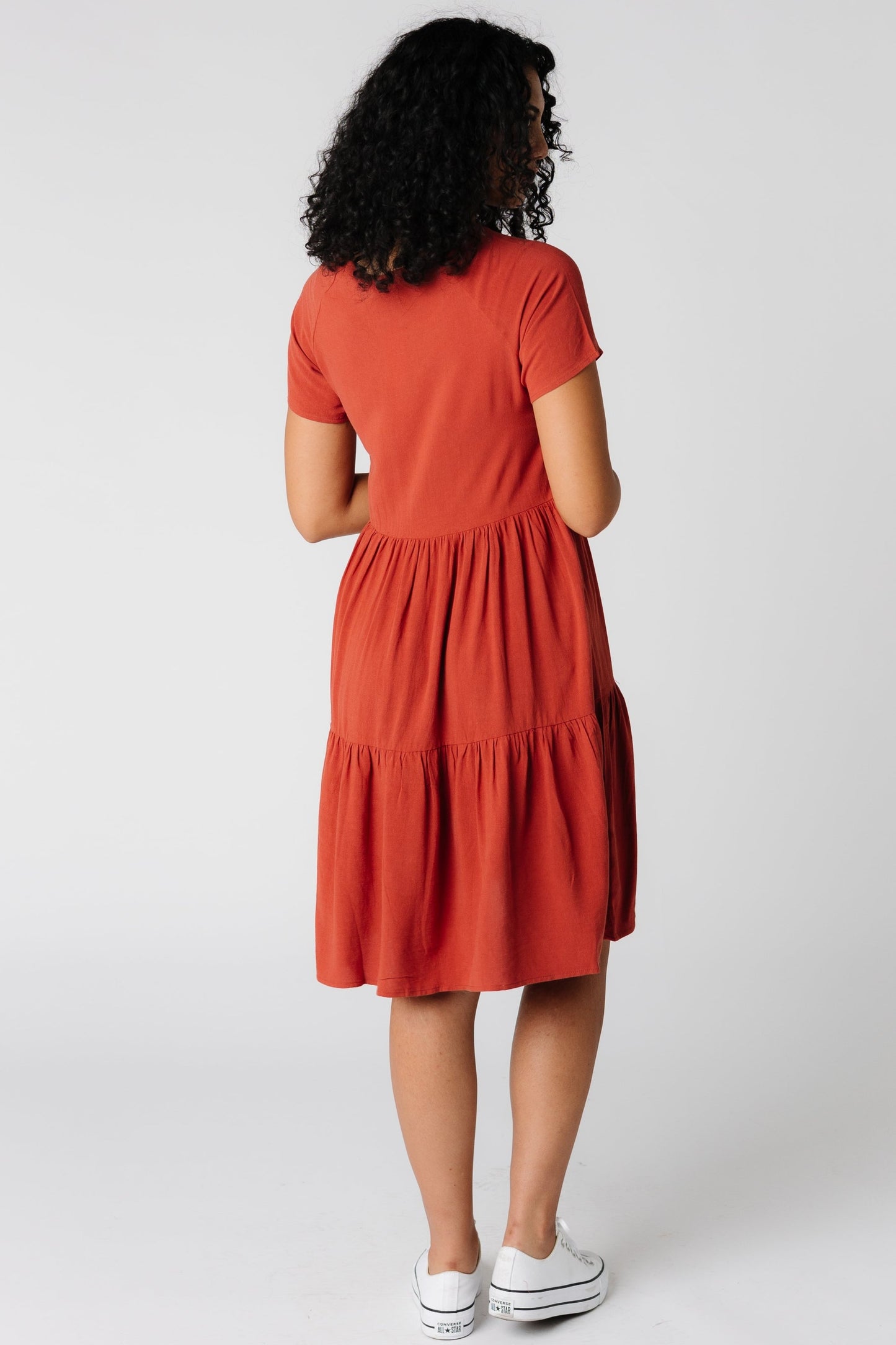 Back view of short sleeve rust dress