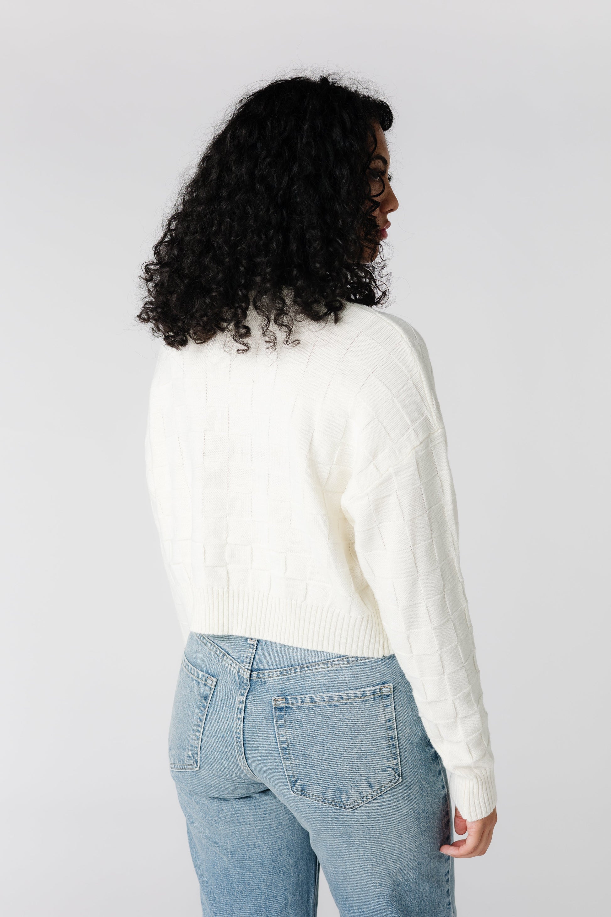 Back view of cream textured sweater