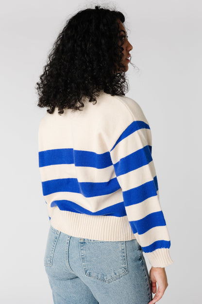 Back view of cream and blue stripe sweater