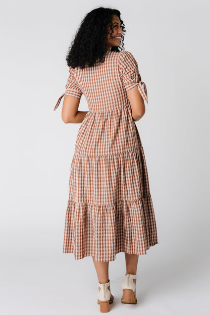 Back view of brown gingham midi dress