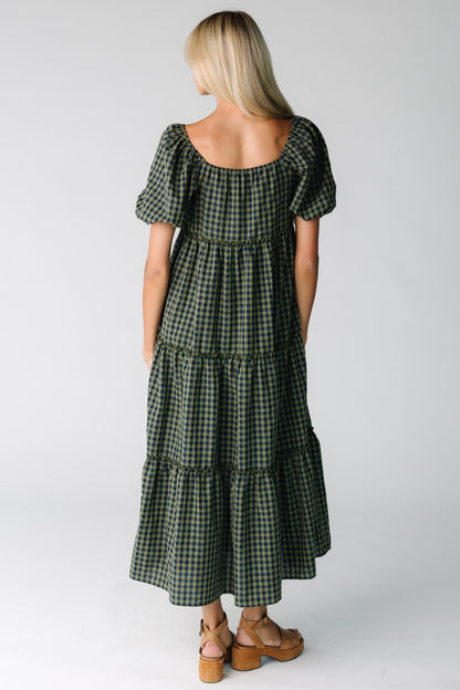 Back view of loose fitting gingham dress in green and navy