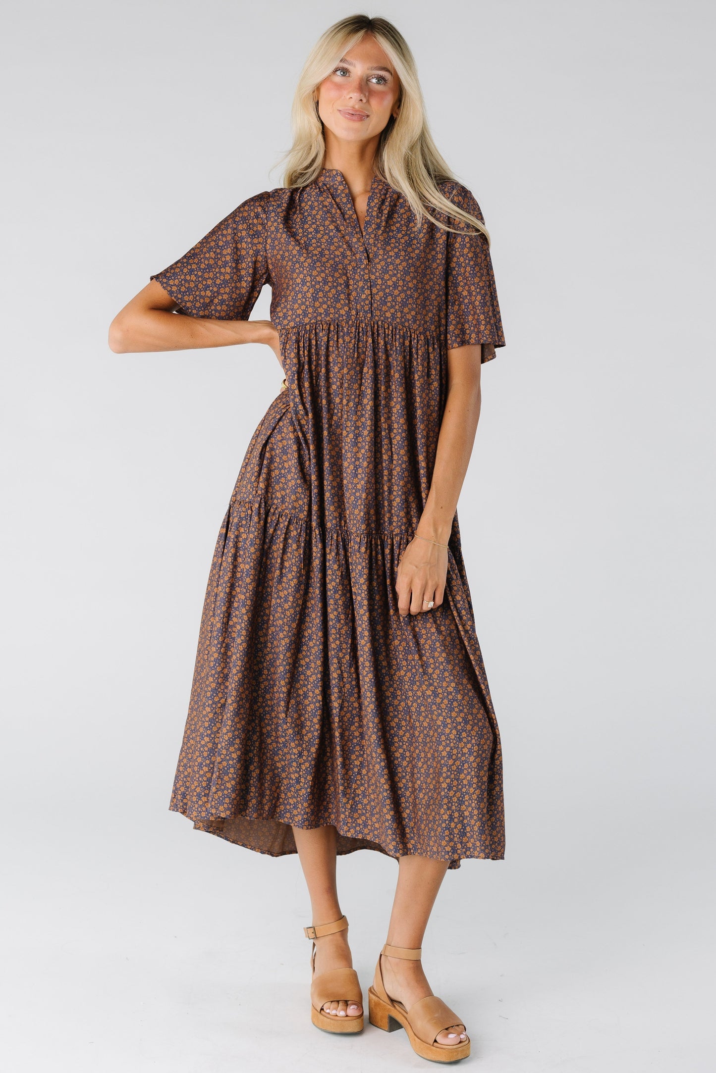 Woman wearing a loose fitting midi dress with short sleeves