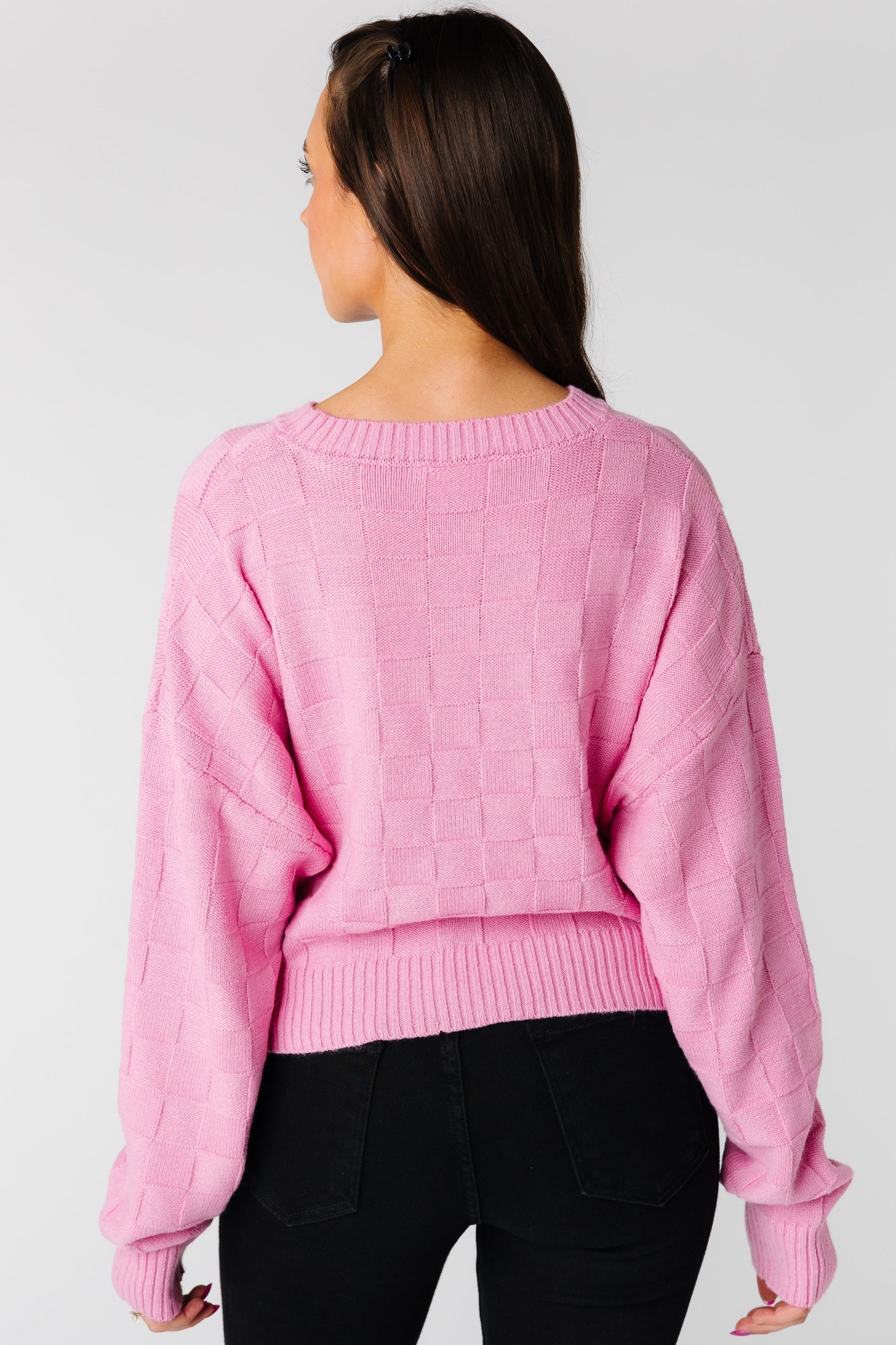 Back view of pink textured sweater 