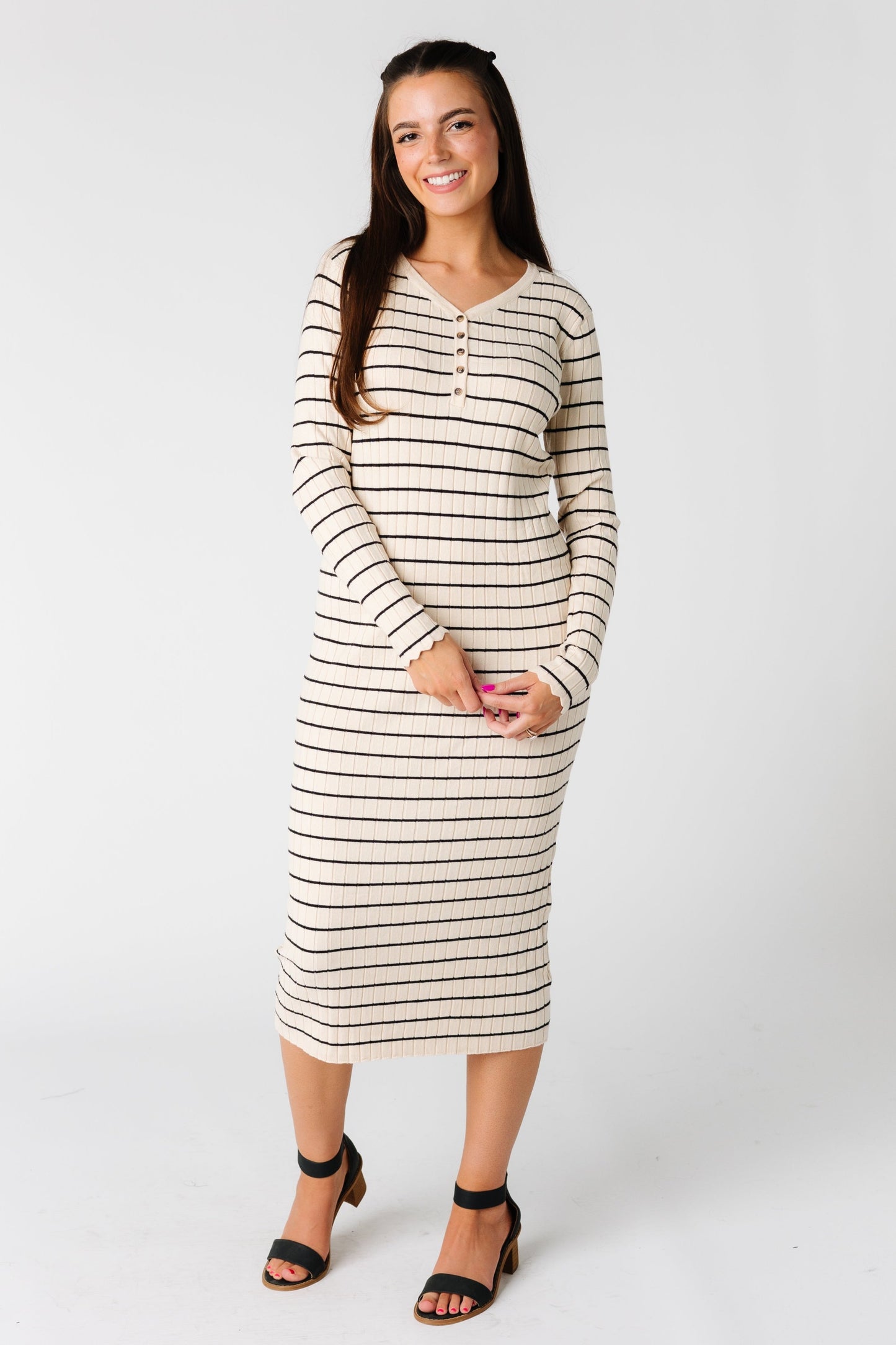 Close fitting midi length sweater dress