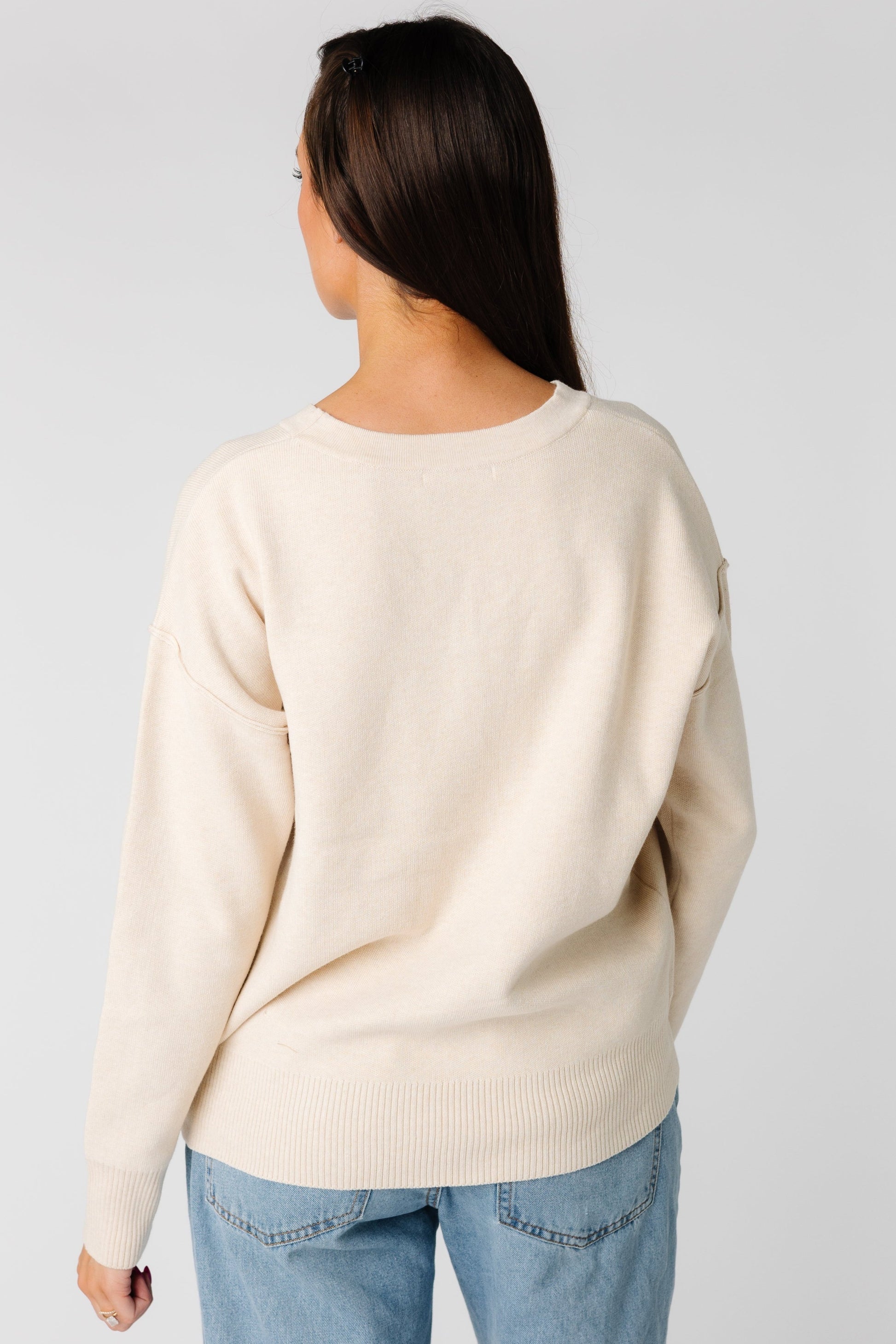 Back view of oatmeal long sleeve sweater