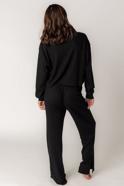 Back view of matching pant set with wide leg and long sleeves