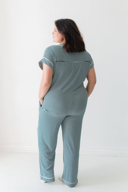 Back view of green stripe one piece pajama with short sleeves