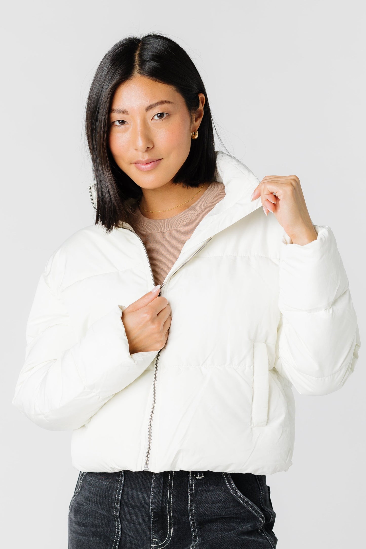 Cream puffer jacket with front pockets