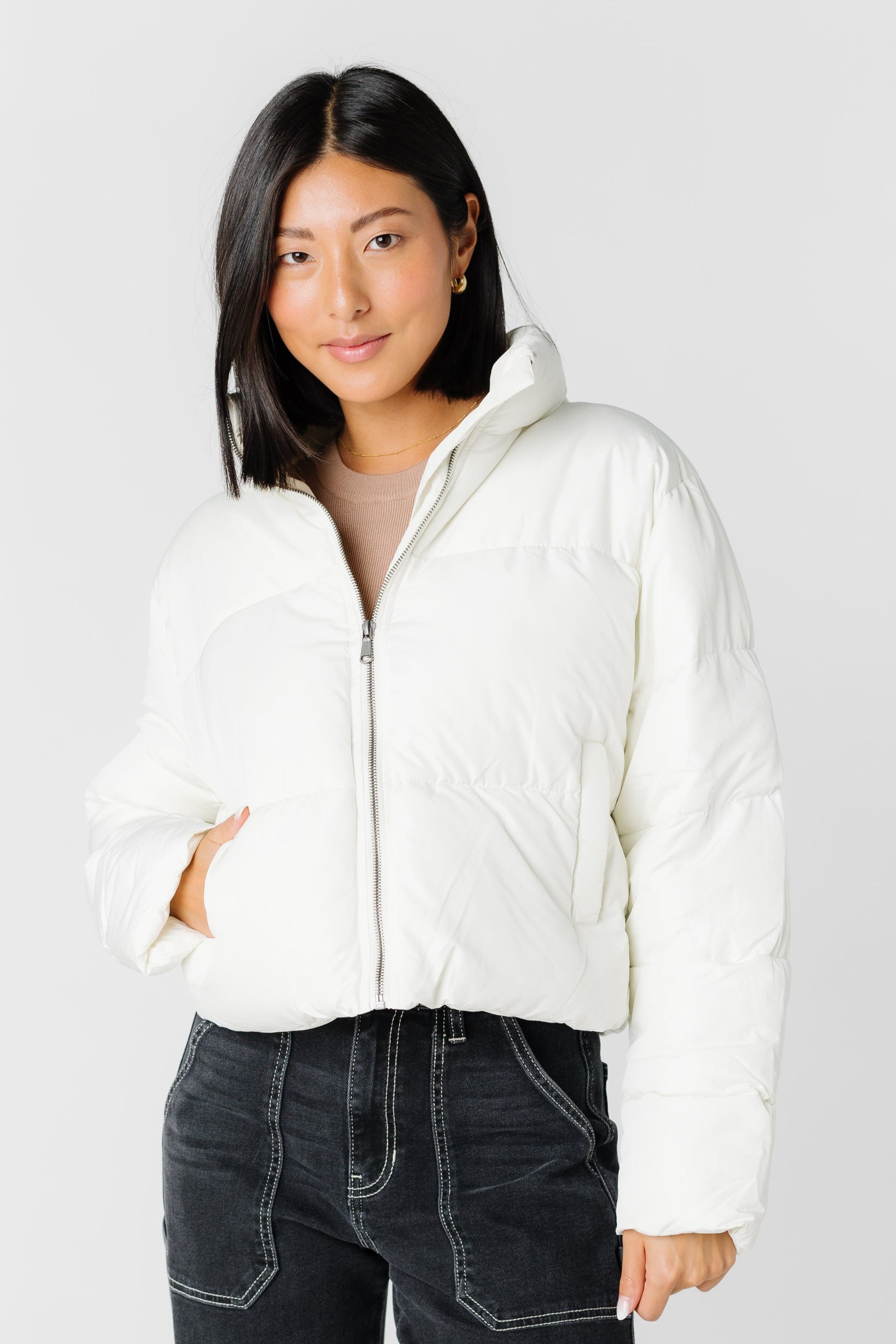 Modest cream puffer jacket with zipper closure