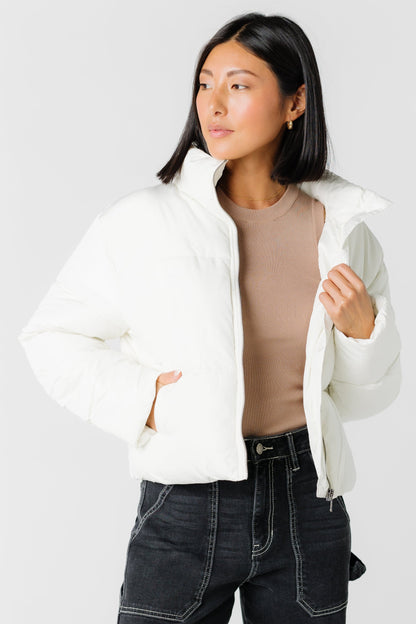 Cream puffer jacket with front pockets