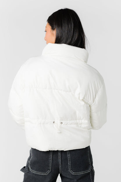 Back view of cream puffer jacket