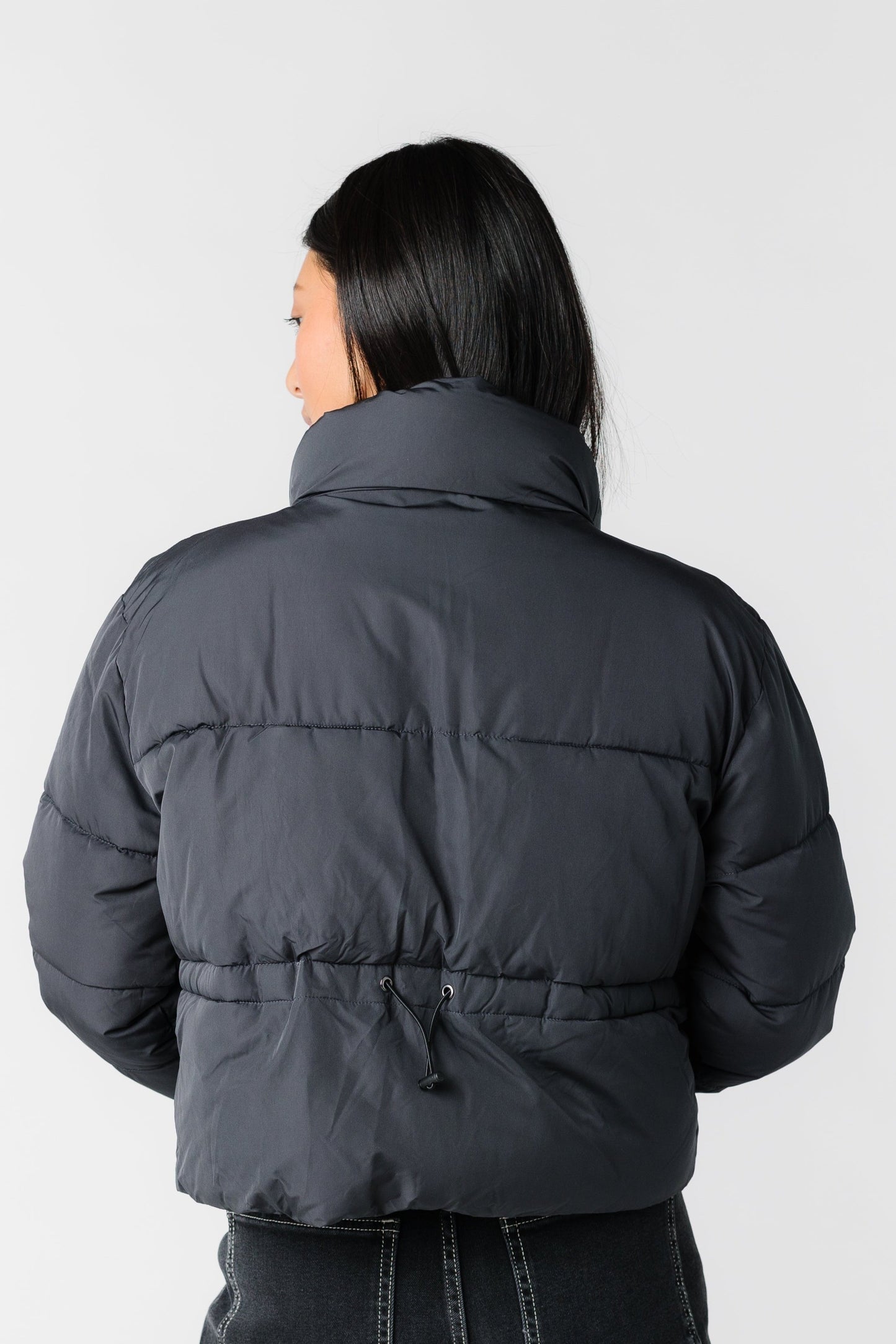 Back view of black puffer jacket