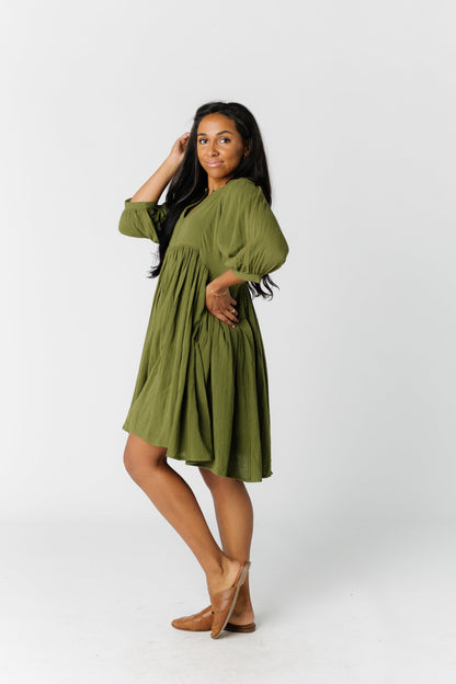 Side view of olive knee length dress 