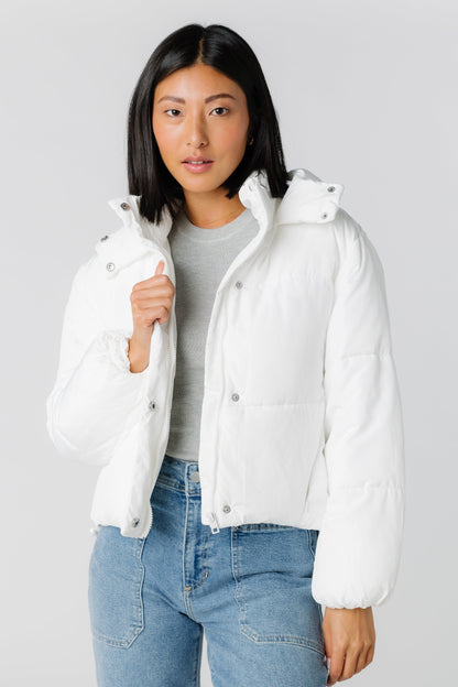 Modest white puffer jacket with zipper and snap closure