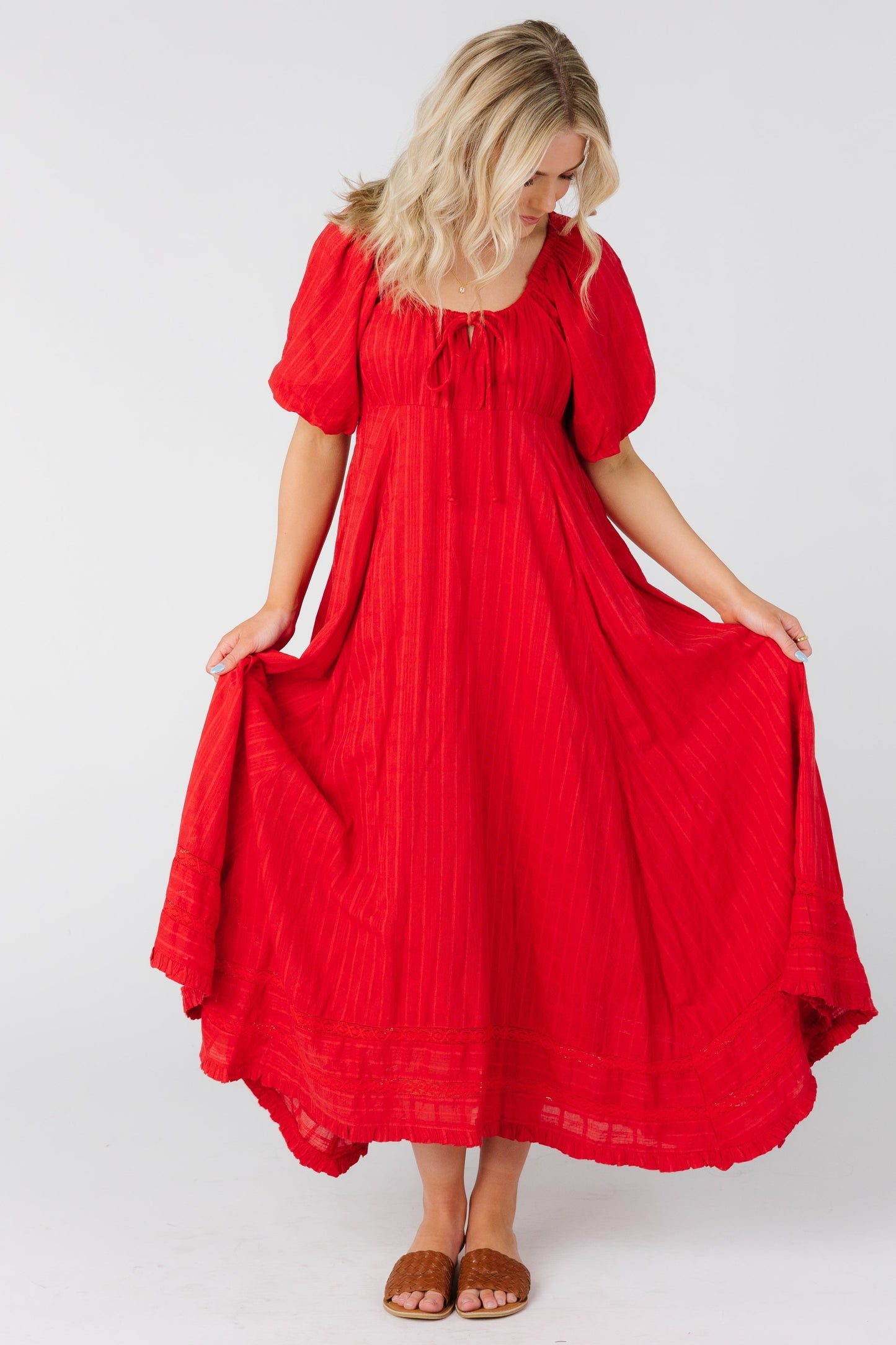 Woman wearing a red maxi dress with short sleeves