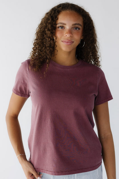 Teenage girl wearing a wine color short sleeve tee with a round neckline.