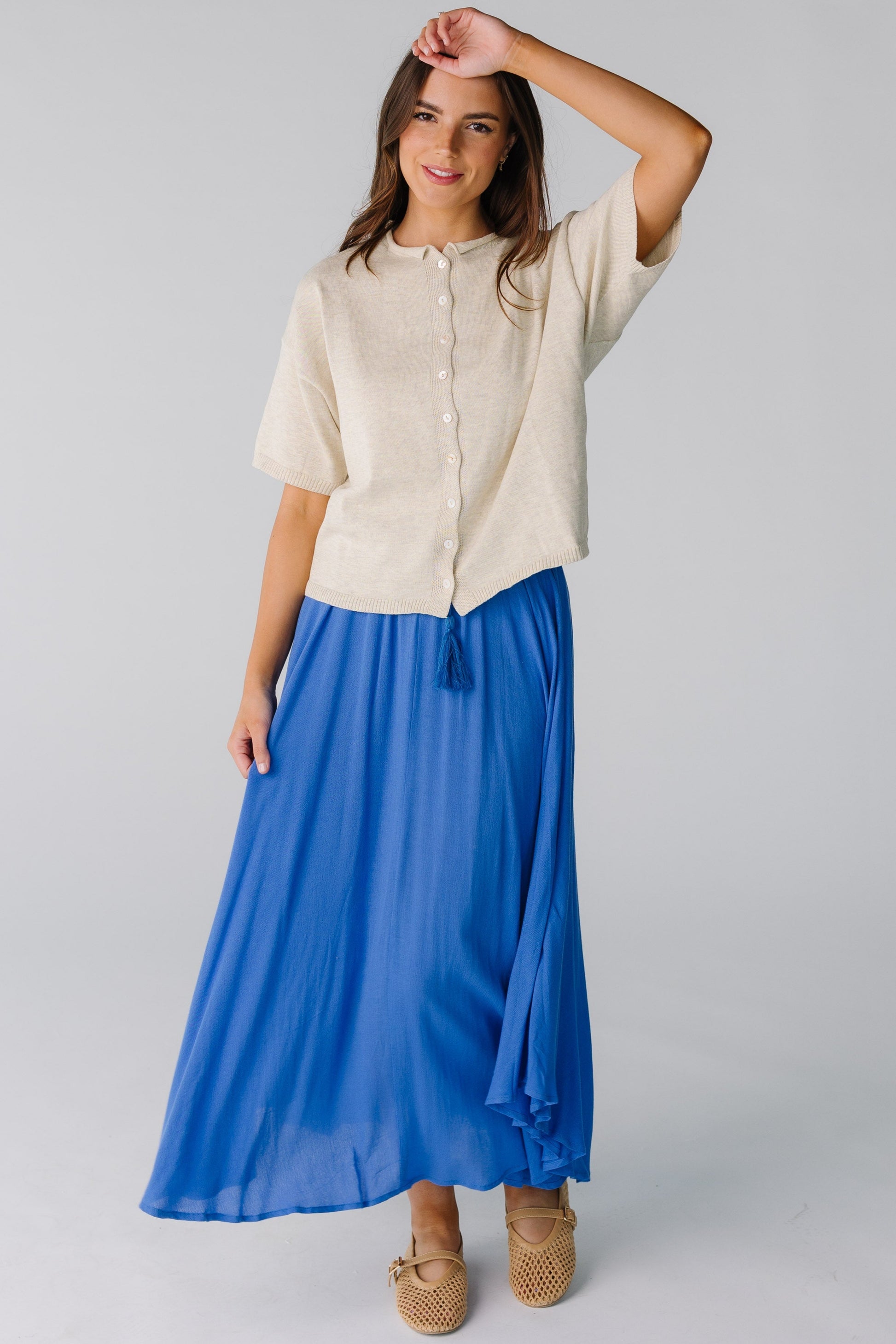 Modest very full midi skirt with curved hemline in blue