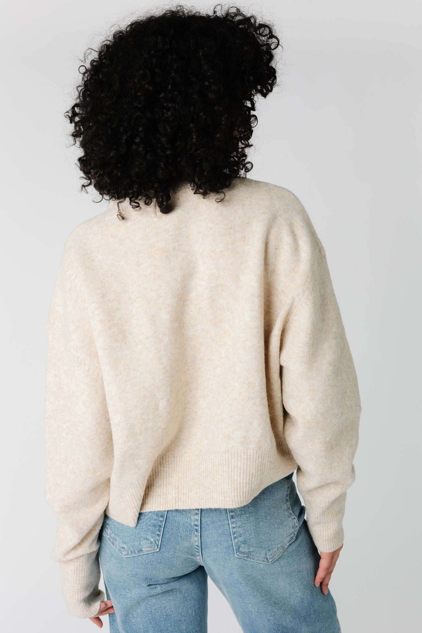 Back view of oatmeal color loose fitting sweater