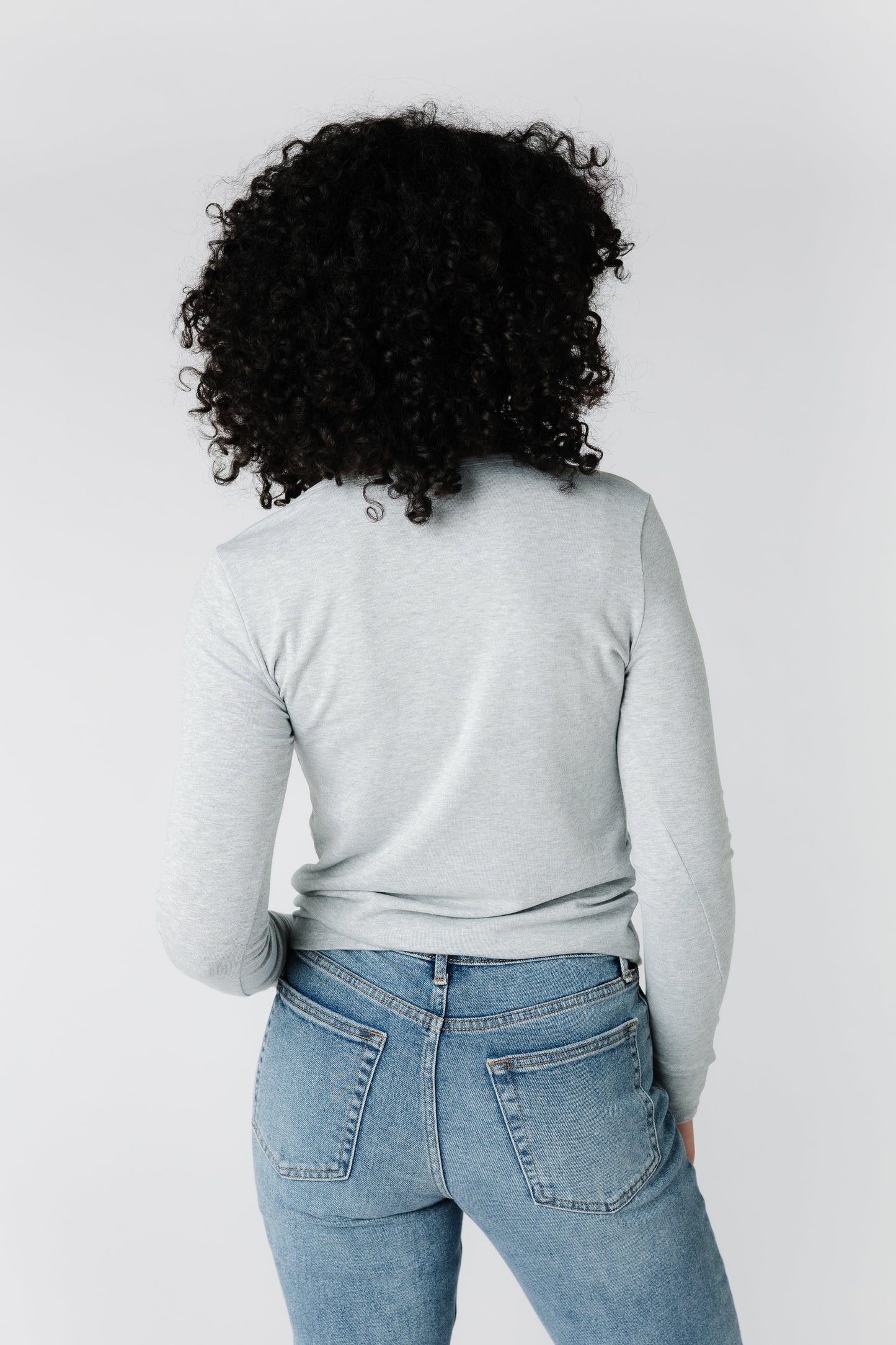 Back view of light grey knit long sleeve top