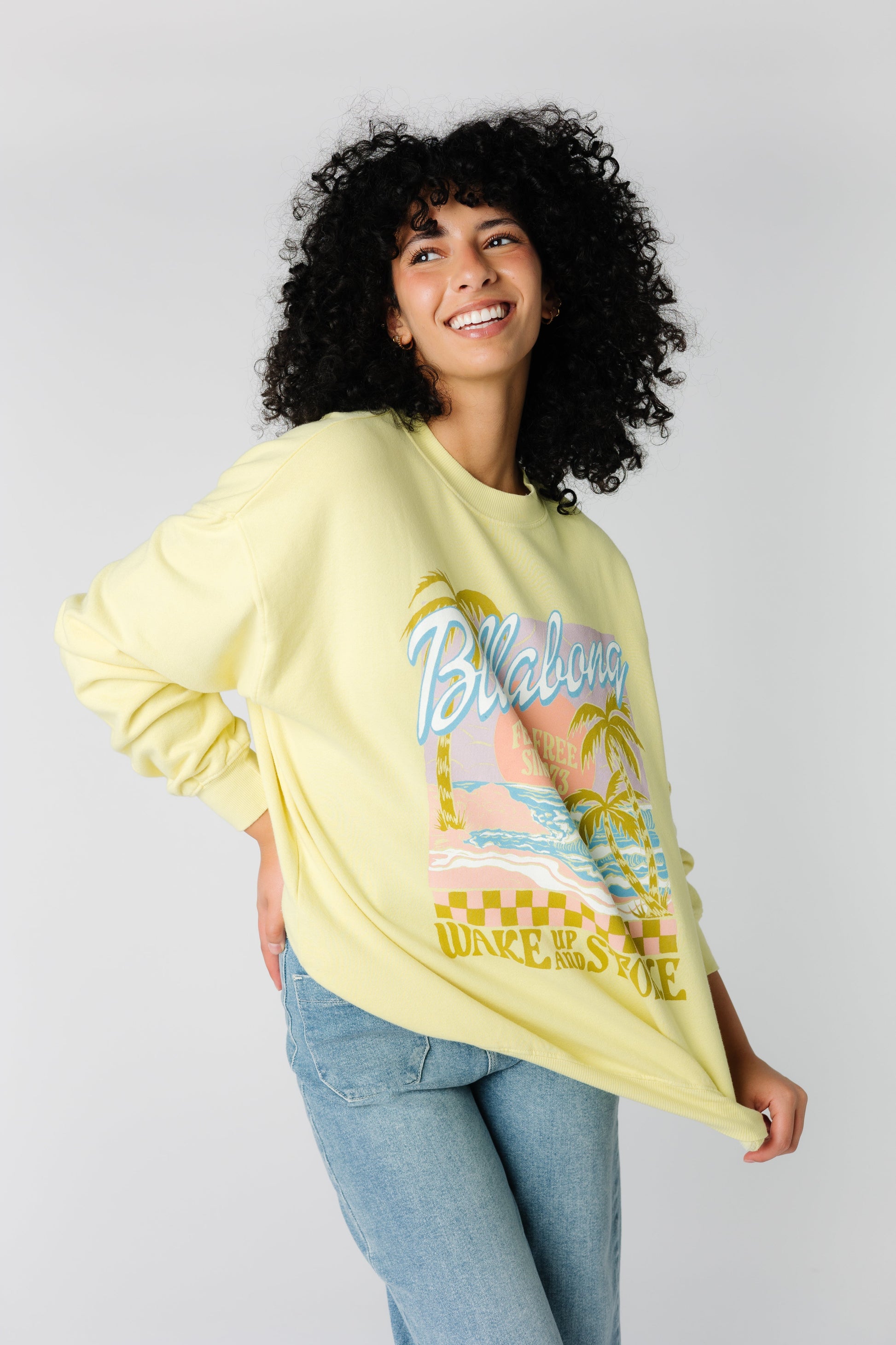 Loose fitting yellow graphic sweatshirt with large front graphic by Billabong ABJFT00281