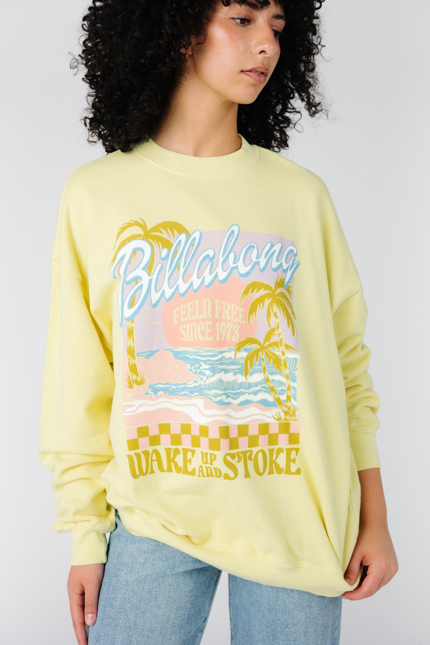 Modest yellow long sleeve sweatshirt with large front graphic by Billabong ABJFT00281