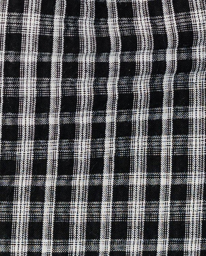 Fabric swatch in black and white plaid