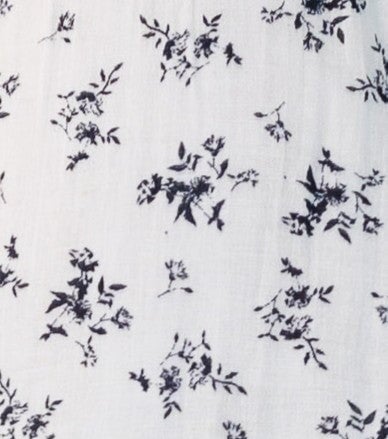 Black floral print on white fabric swatch.