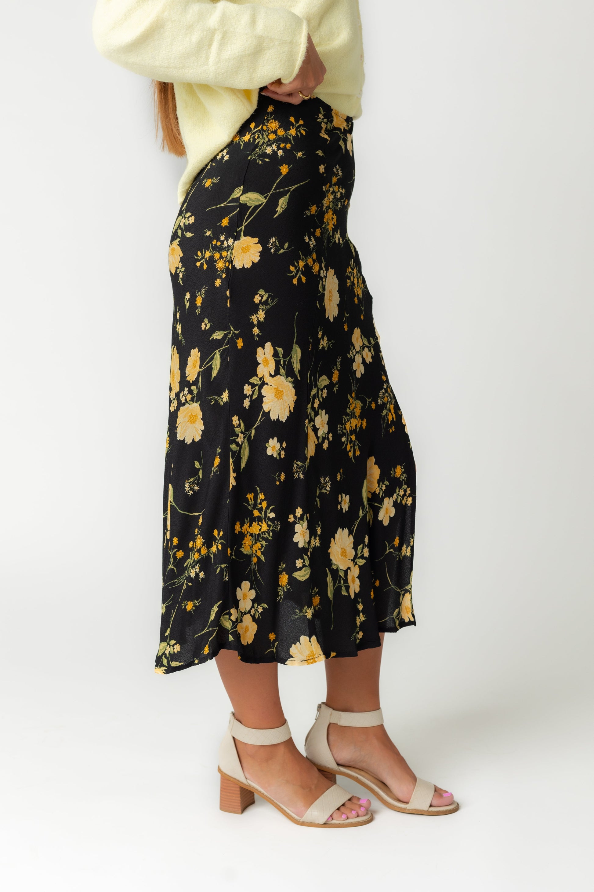 Side view of black floral midi skirt