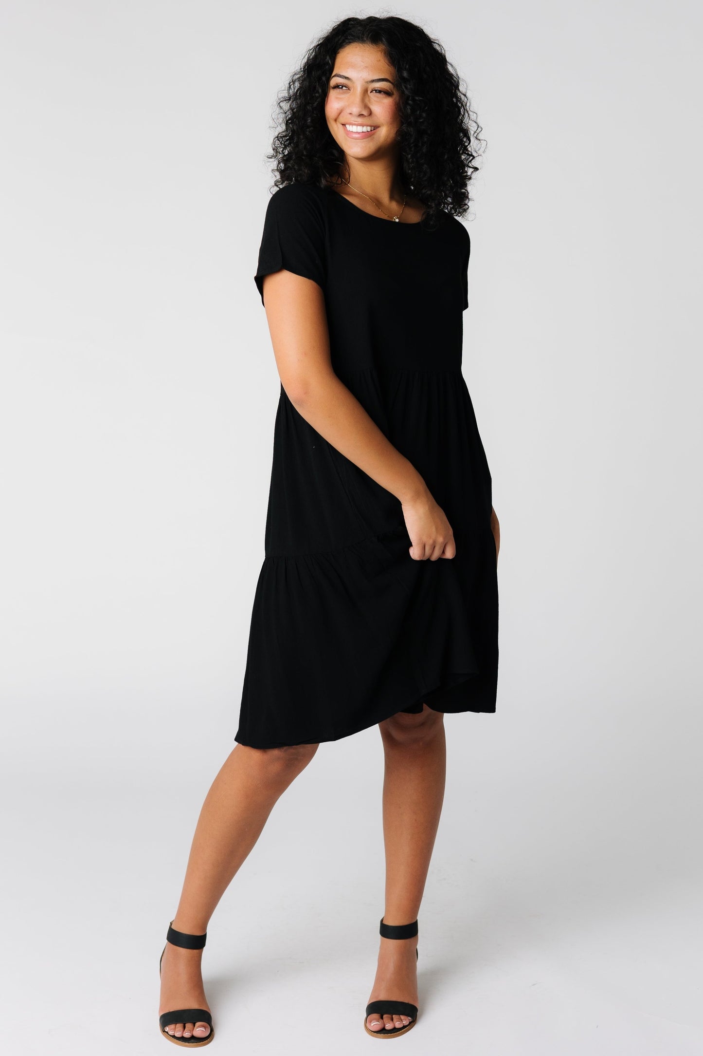 Black dress with round neckline and short sleeves