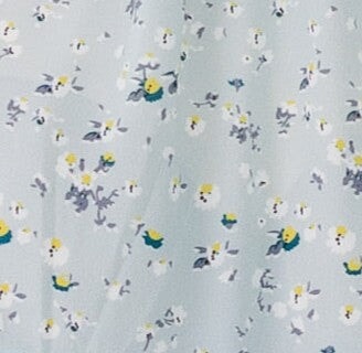Light blue floral fabric swatch.