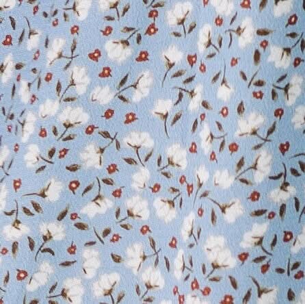 Blue and white floral print fabric swatch.