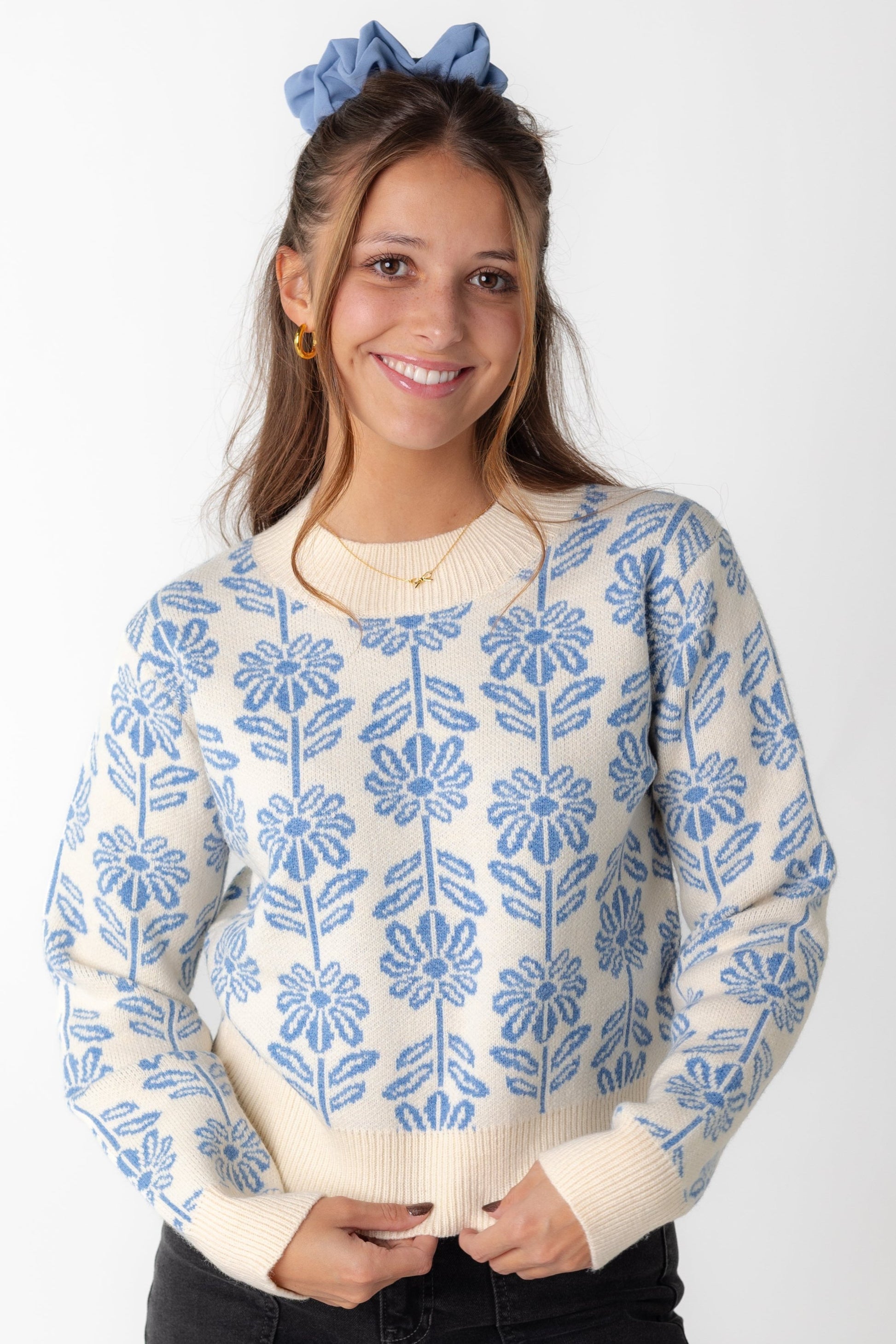 Blue floral sweater with crew neckline and long sleeves