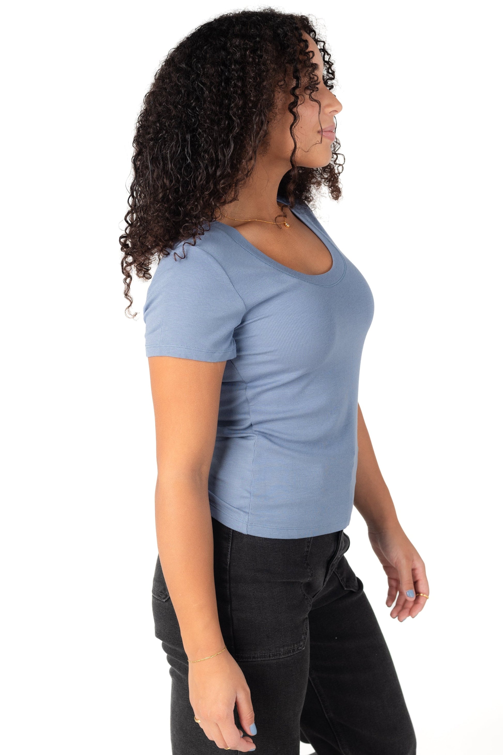 Side view of short sleeve close fitting stretchy tee with scoop neckline in slate blue