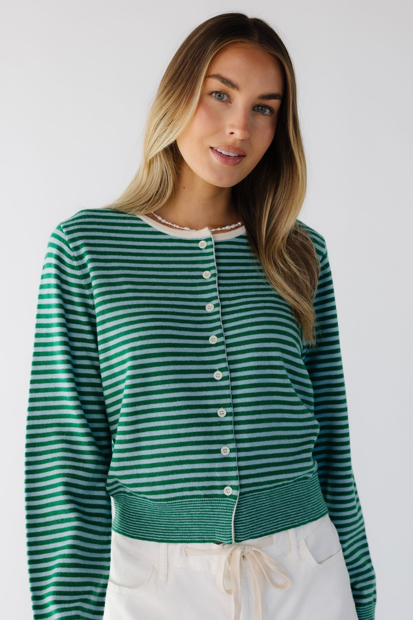 The Andy Sweater i green & light blue stripe for women and teenage girls.