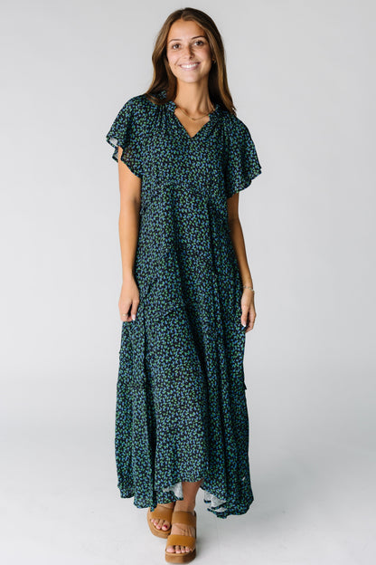Woman wearing a modest midi-maxi dress with multiple tiers