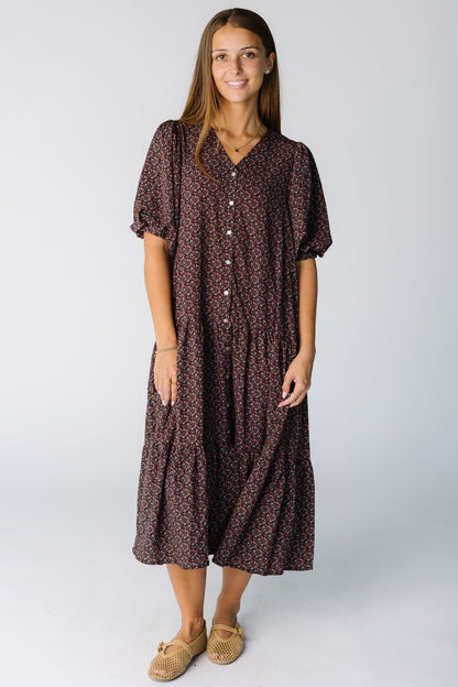 Woman wearing a tiered midi dress with a V-neckline