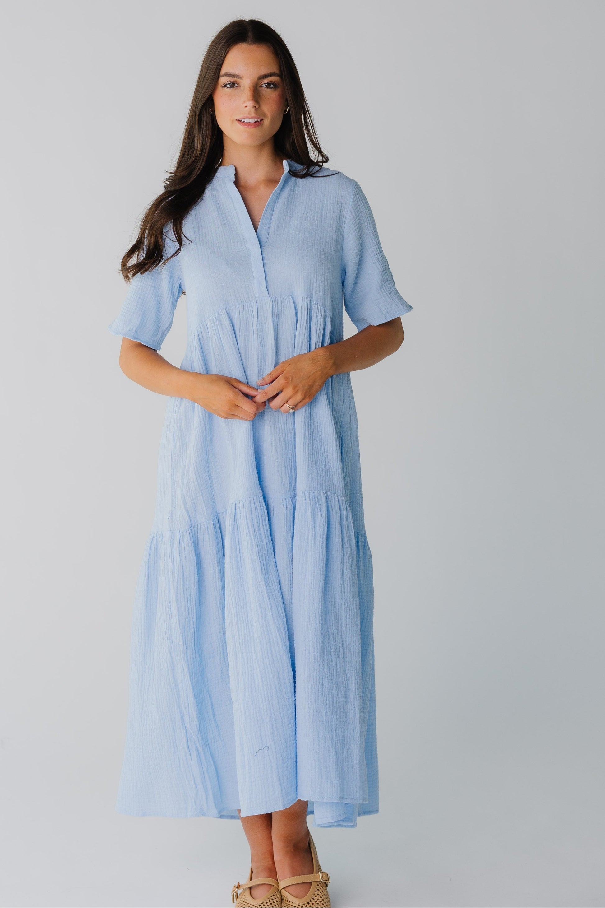 Modest light blue women's midi dress with short sleeves and V-neckline