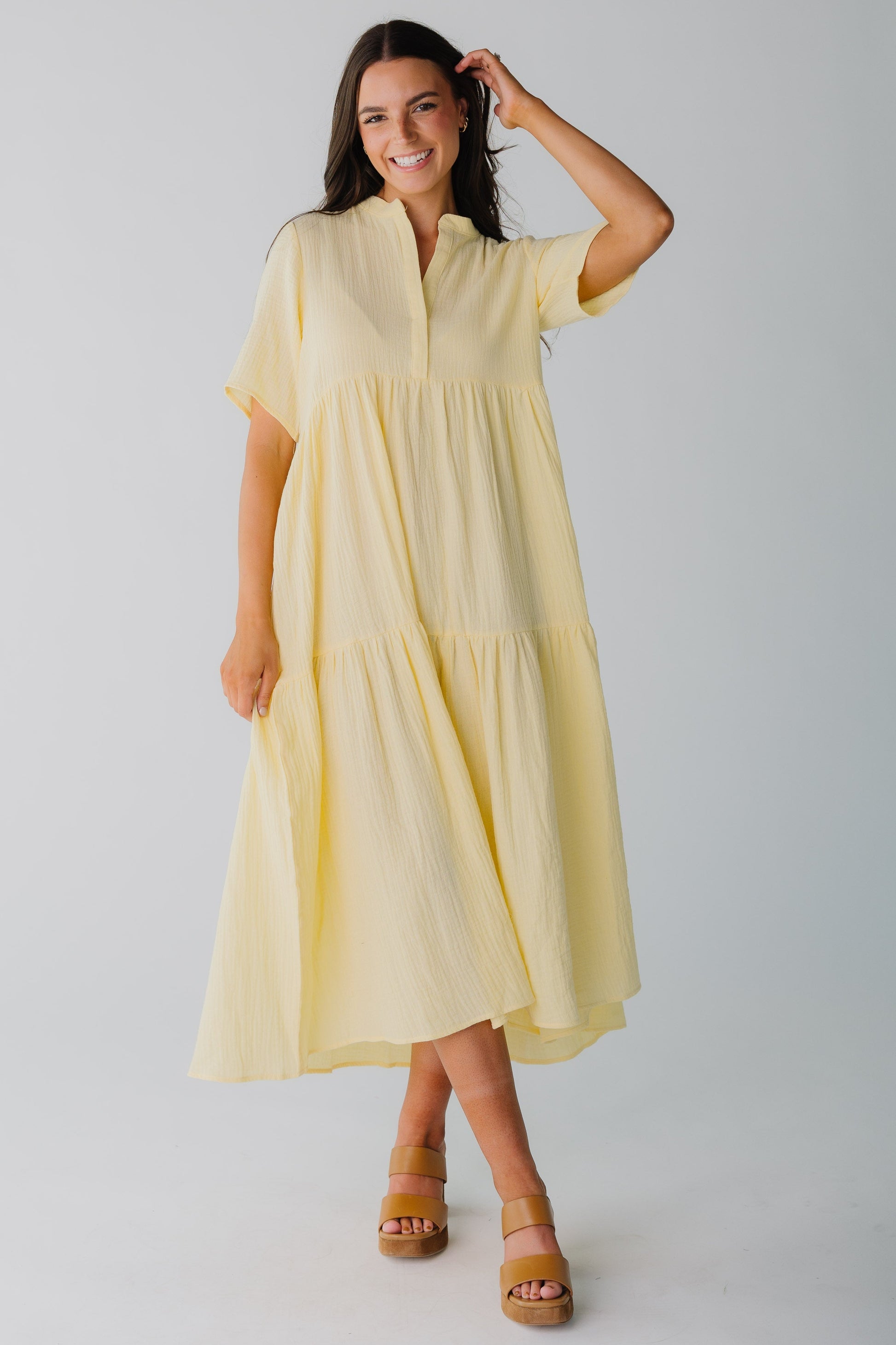 Modest light yellow women's midi dress with short sleeves and V-neckline